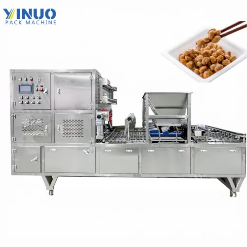 Máquina llenadora y selladora de cajas